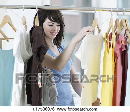 Young Woman Shopping Clothes View Large Photo Image Stock Photograph - Young Woman Shopping Clothes. Fotosearch