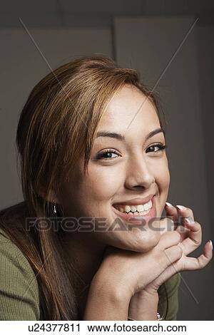 Young woman smiling (portrait) View Large Photo Image Stock Image - Young woman smiling (portrait). Fotosearch