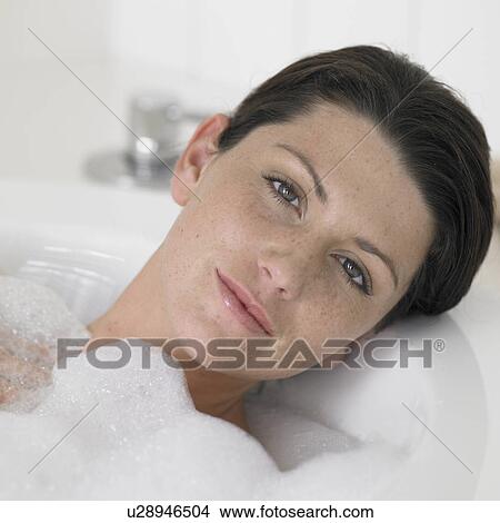 Young woman taking bath View Large Photo Image Picture - Young woman taking bath. Fotosearch