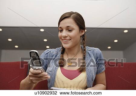 College student using cell phone in lecture theater View Large Photo Image Stock Image - College student using cell phone in lecture theater. Fotosearch