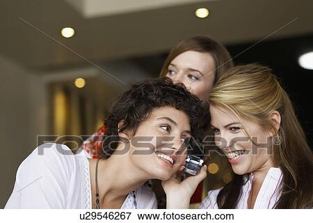 Three teenage girls with cell phone View Large Photo Image Stock Photo - Three teenage girls with cell phone. Fotosearch