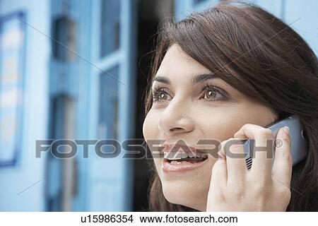 Young woman on cell phone View Large Photo Image Picture - Young woman on cell phone. Fotosearch