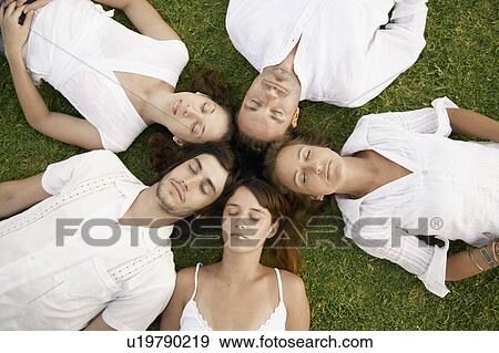 Stock Photo - Five friends forming a circle (portrait, directly above). Fotosearch