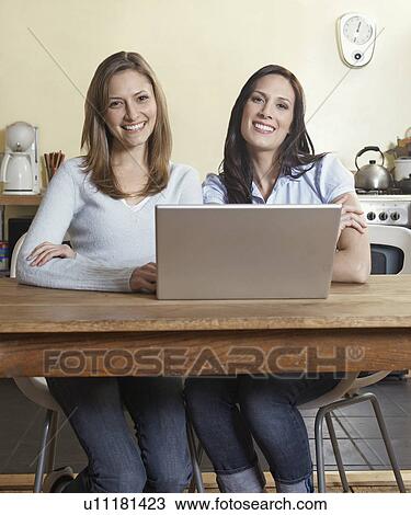 Two Women Using Laptop View Large Photo Image Stock Image - Two Women Using Laptop. Fotosearch