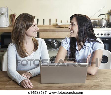 Two Women Using Laptop View Large Photo Image Stock Photo - Two Women Using Laptop. Fotosearch