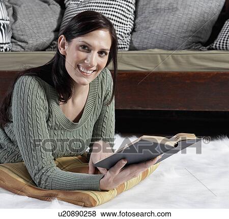 Mid-Adult Woman Reading on Floor View Large Photo Image Stock Photo - Mid-Adult Woman Reading on Floor. Fotosearch