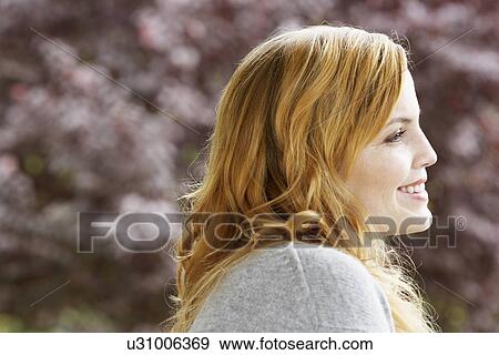 Young woman smiling View Large Photo Image Stock Photo - Young woman smiling. Fotosearch