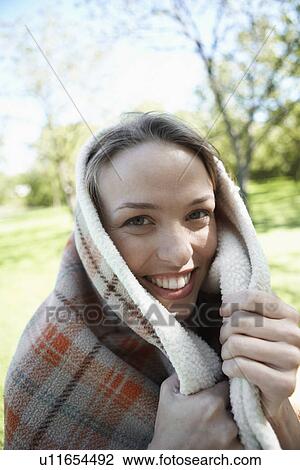 Young woman wrapped in a blanket (portrait) View Large Photo Image Stock Image - Young woman wrapped in a blanket (portrait). Fotosearch