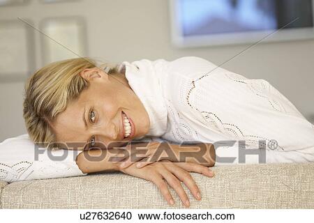 Stock Image - Mid adult woman in turtleneck (portrait). Fotosearch