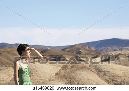 Woman looking at view in desert, Death Valley, California, USA View Large Photo Image Stock Photograph - Woman looking at view in desert, Death Valley, California, USA. Fotosearch