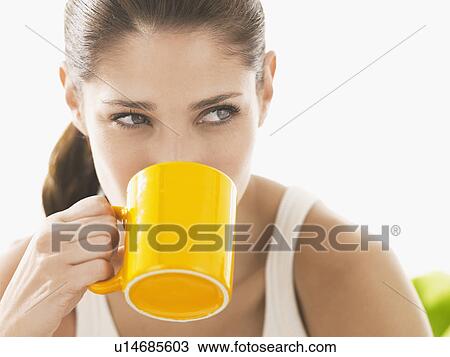 Young woman drinking coffee View Large Photo Image Stock Image - Young woman drinking coffee. Fotosearch