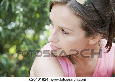 Young woman (high angle view) View Large Photo Image Picture - Young woman (high angle view). Fotosearch
