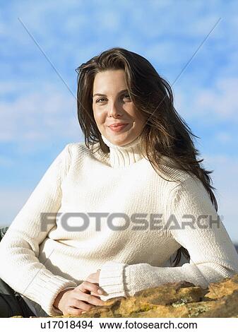Picture - Young woman in turtleneck sweater, portrait. Fotosearch
