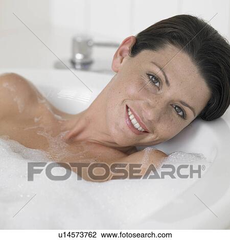 Young woman taking bath View Large Photo Image Stock Image - Young woman taking bath. Fotosearch