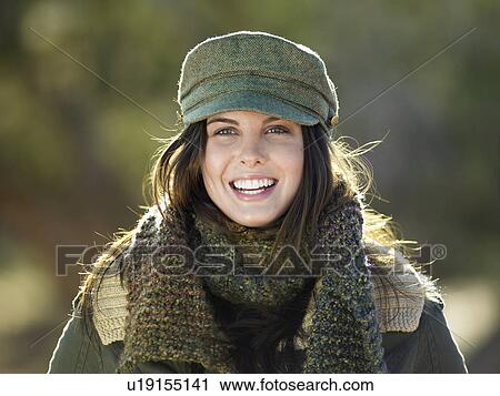 Young woman wearing hat and scarf, portrait View Large Photo Image Stock Image - Young woman wearing hat and scarf, portrait. Fotosearch