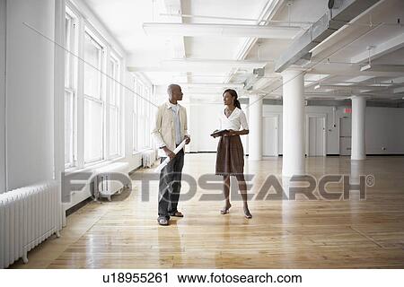 Architects in empty office View Large Photo Image Stock Image - Architects in empty office. Fotosearch
