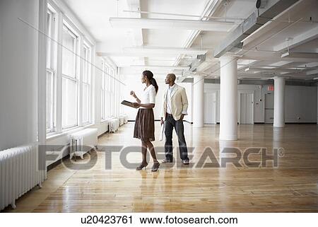 Stock Image - Architects planning in empty office. Fotosearch