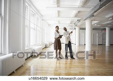 Architects planning in empty office View Large Photo Image Stock Photo - Architects planning in empty office. Fotosearch