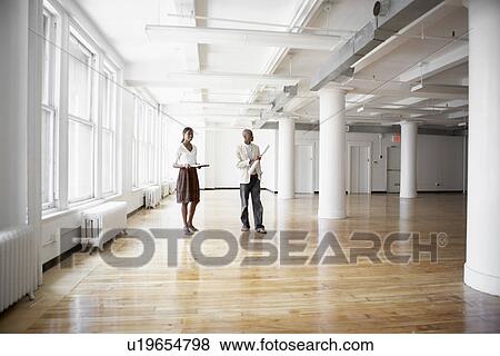 Architects planning in empty office View Large Photo Image Stock Photo - Architects planning in empty office. Fotosearch