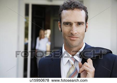 Businessman leaving home for work View Large Photo Image Stock Photo - Businessman leaving home for work. Fotosearch