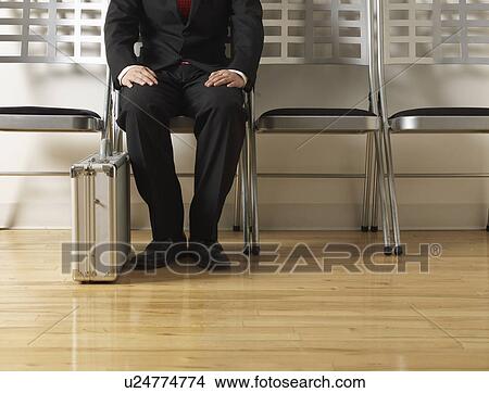 Businessman Sitting on Folding Chair View Large Photo Image Picture - Businessman Sitting on Folding Chair. Fotosearch