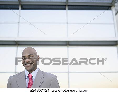 Stock Image - Businessman smiling (portrait). Fotosearch