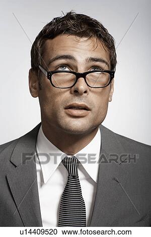 Stock Image - Portrait of mid adult businessman. Fotosearch