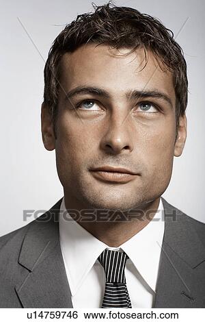Stock Photograph - Portrait of mid adult businessman. Fotosearch