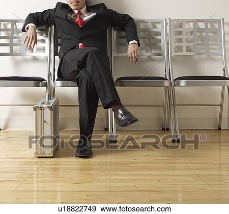 Stock Photo - Relaxed Businessman in Waiting Room. Fotosearch