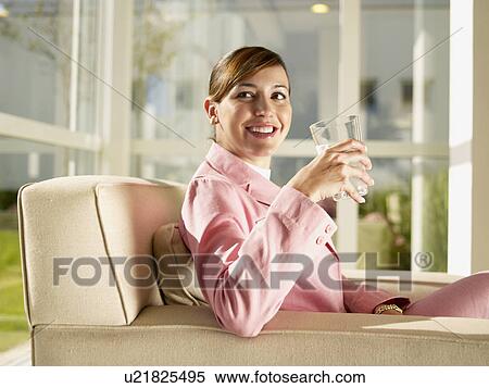 Businesswoman drinking water View Large Photo Image Stock Photography - Businesswoman drinking water. Fotosearch