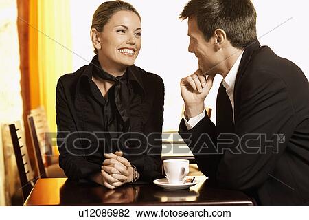 Man and woman talking in cafe View Large Photo Image Stock Image - Man and woman talking in cafe. Fotosearch