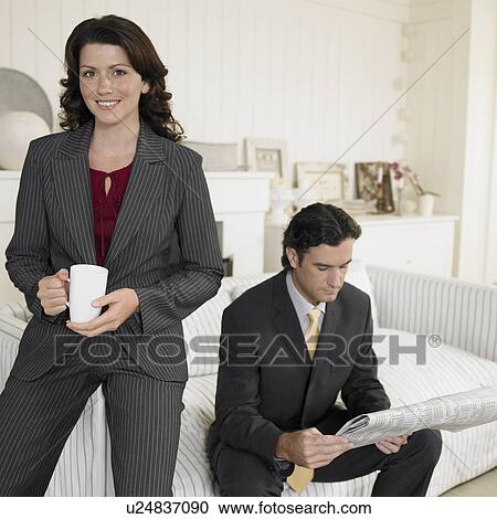 Mid adult couple in living room View Large Photo Image Stock Image - Mid adult couple in living room. Fotosearch