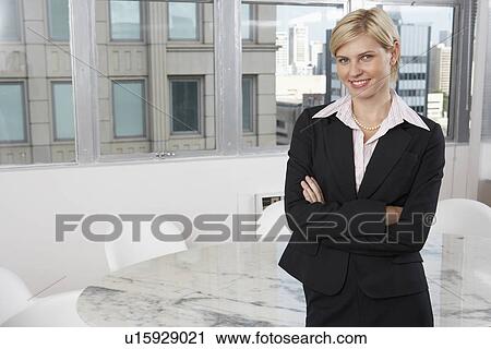 Young businesswoman in conference room (portrait) View Large Photo Image Stock Image - Young businesswoman in conference room (portrait). Fotosearch