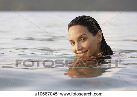 Young woman swimming View Large Photo Image Stock Photography - Young woman swimming. Fotosearch