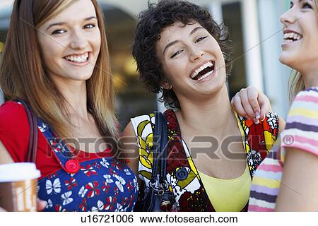 Stock Photograph - Teenage girls laughing. Fotosearch