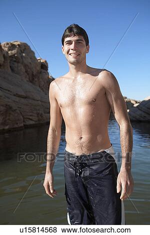 Wet young man at lake View Large Photo Image Stock Photo - Wet young man at lake. Fotosearch