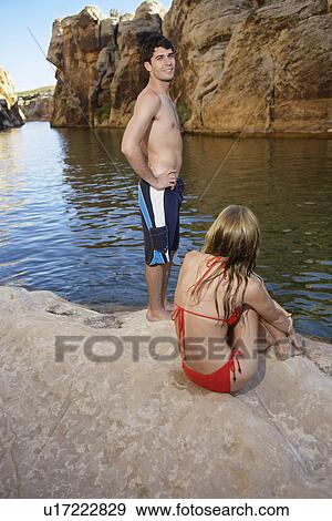Young couple at lake View Large Photo Image Stock Photo - Young couple at lake. Fotosearch