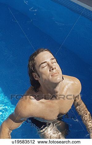 Stock Image - Young Man in Swimming Pool. Fotosearch