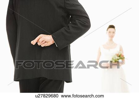 Back of groom with his fingers crossed and bride in background View Large Photo Image Stock Image - Back of groom with his fingers crossed and bride in background. Fotosearch
