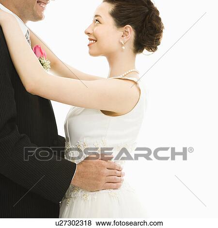 Caucasian groom and Asian bride dancing. View Large Photo Image Stock Photo - Caucasian groom and Asian bride dancing.. Fotosearch