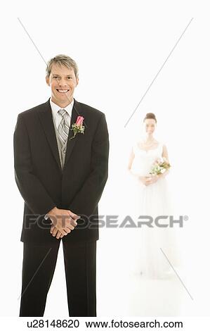 Caucasian groom in foreground and Asian bride in background. View Large Photo Image Stock Image - Caucasian groom in foreground and Asian bride in background.. Fotosearch