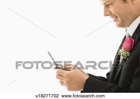 Caucasian groom texting on cellphone. View Large Photo Image Stock Image - Caucasian groom texting on cellphone.. Fotosearch
