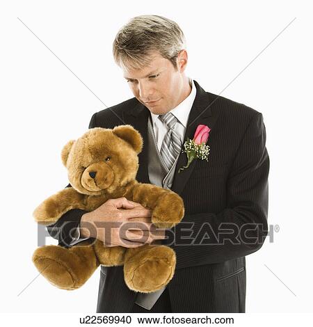 Groom hugging teddy bear View Large Photo Image Stock Image - Groom hugging teddy bear. Fotosearch