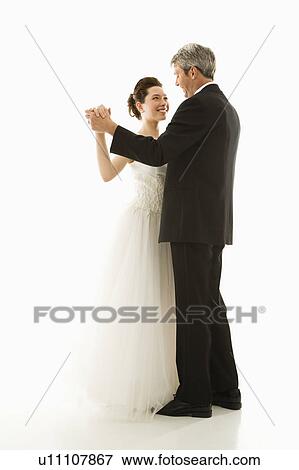 Stock Photo - Portrait of bride and groom dancing. Fotosearch