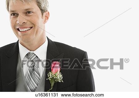 Portrait of Caucasian male in tuxedo with boutonniere. View Large Photo Image Stock Image - Portrait of Caucasian male in tuxedo with boutonniere.. Fotosearch