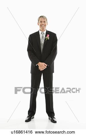Portrait of Caucasian male in tuxedo with boutonniere. View Large Photo Image Stock Photograph - Portrait of Caucasian male in tuxedo with boutonniere.. Fotosearch
