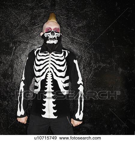 Male punk wearing skeleton sweatshirt and skeleton bandanna View Large Photo Image Stock Photo - Male punk wearing skeleton sweatshirt and skeleton bandanna. Fotosearch