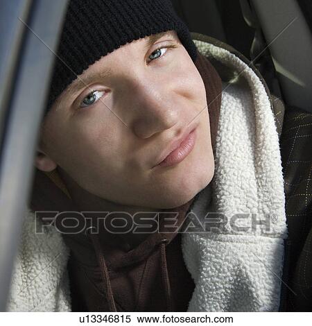 Stock Photography - Male teenager with a smirk. Fotosearch