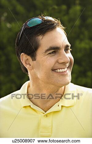 Stock Photo - Man smiling with head turned. Fotosearch