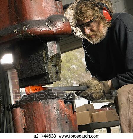 Man using power hammer View Large Photo Image Stock Photo - Man using power hammer. Fotosearch
